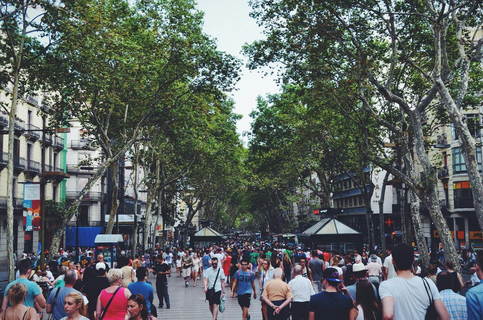 Crowds strolling along La Rambla in Barcelona, Spain