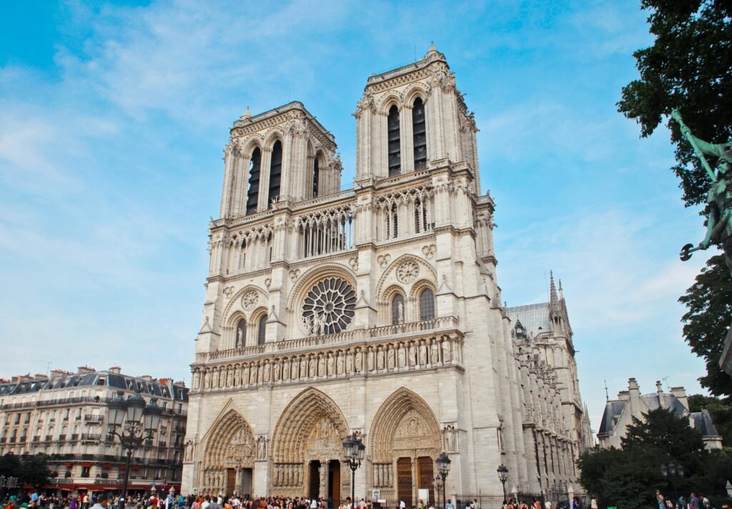 pexels-photo-1460145-1460145 Architectural beauty of Notre Dame Cathedral with crowds in Paris, France.