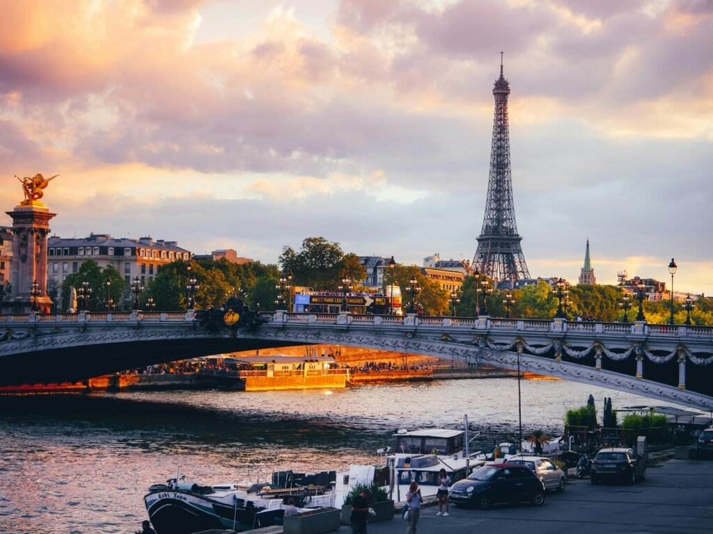 pexels-photo-17350906-17350906 Stunning view of the Eiffel Tower and the Seine River with vibrant sunset colors in Paris, France.