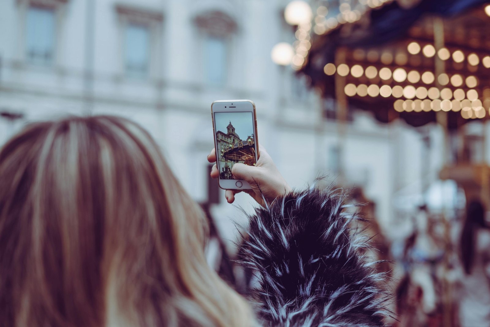 Person editing travel photos on a smartphone