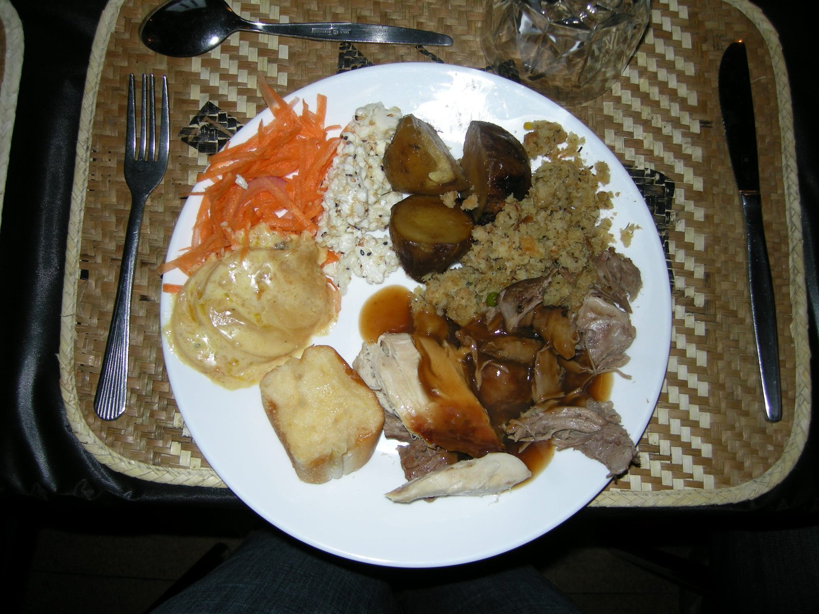 New Zealand traditional Hāngi meal being unearthed from ground.