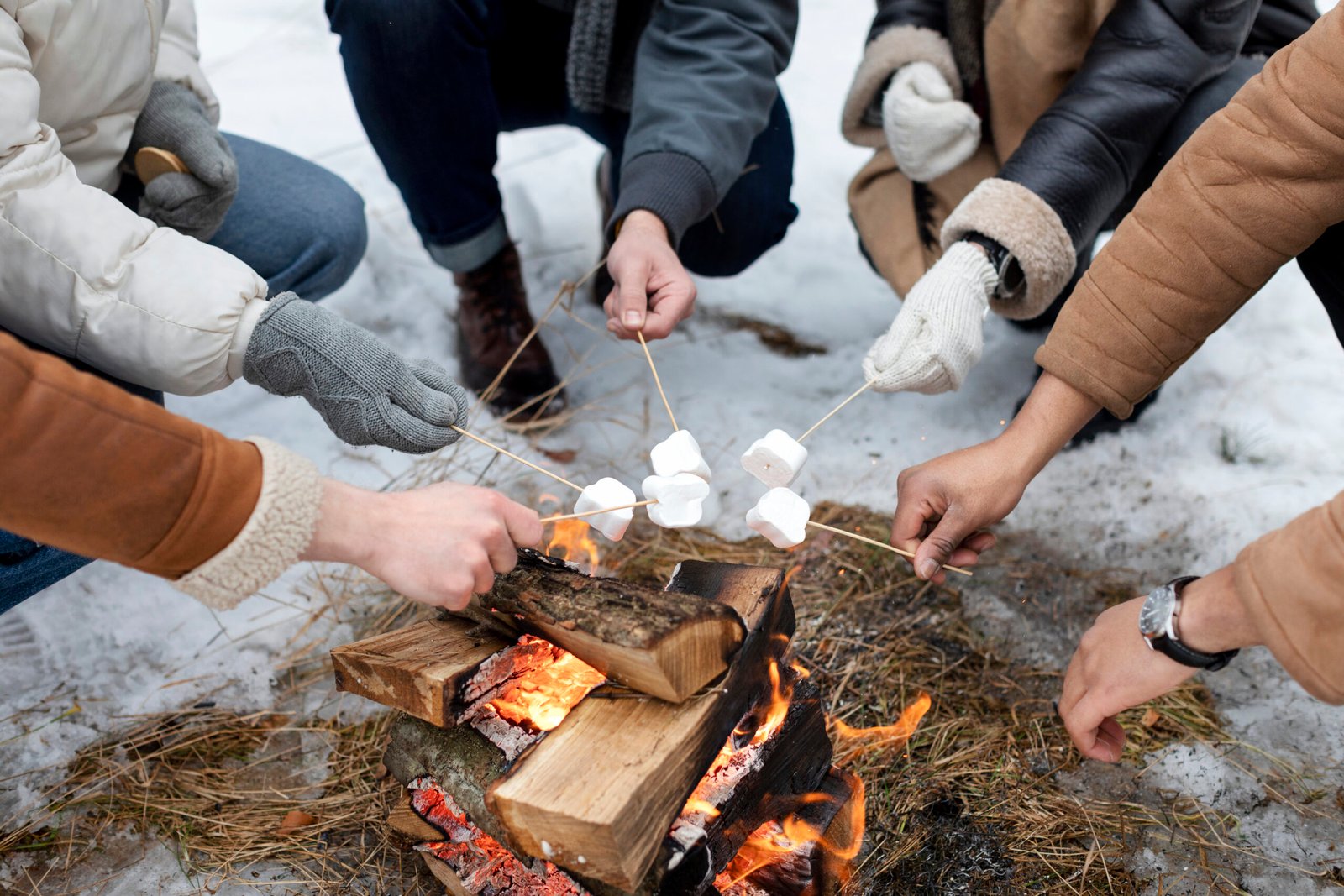 Traveler sharing a meal with locals around a fire.