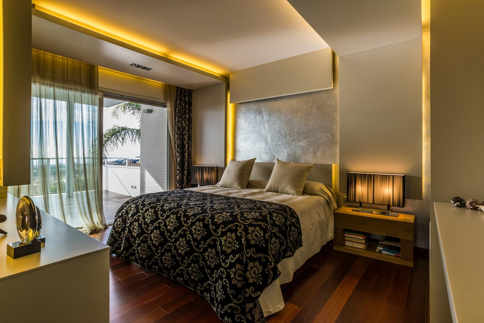 A cozy hotel room in Southeast Asia with traditional decor and modern amenities.