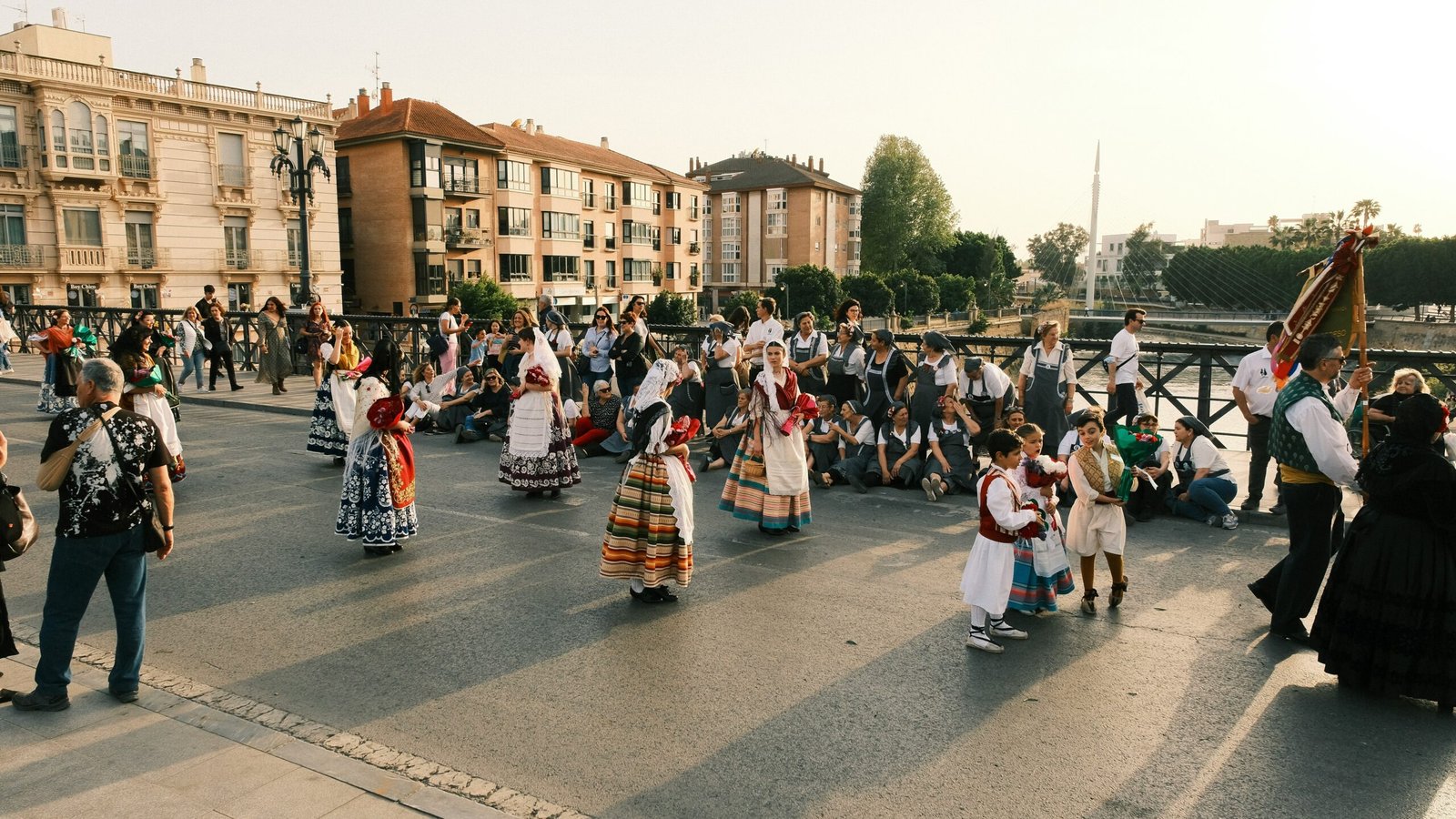 A lively European festival with people dancing in traditional attire.
