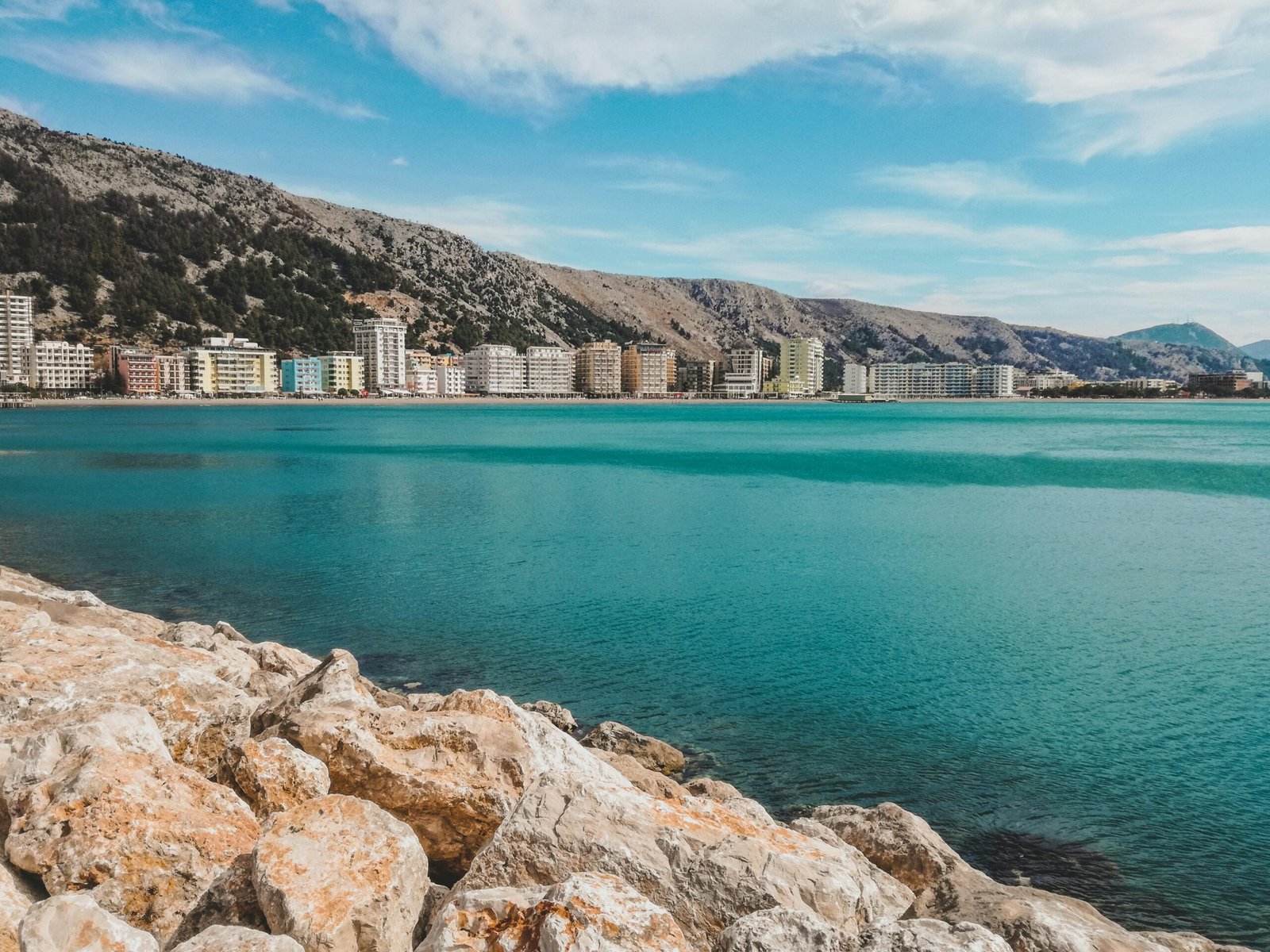 A beachfront villa on Albania’s Riviera, showcasing turquoise waters and serene landscapes.