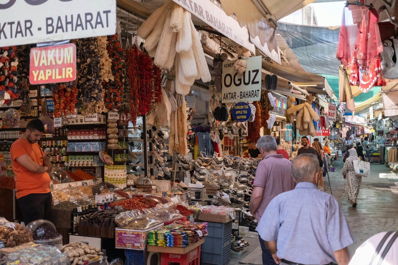 A traveler interacting respectfully with a vendor in a bustling Turkish bazaar, showcasing cultural engagement.