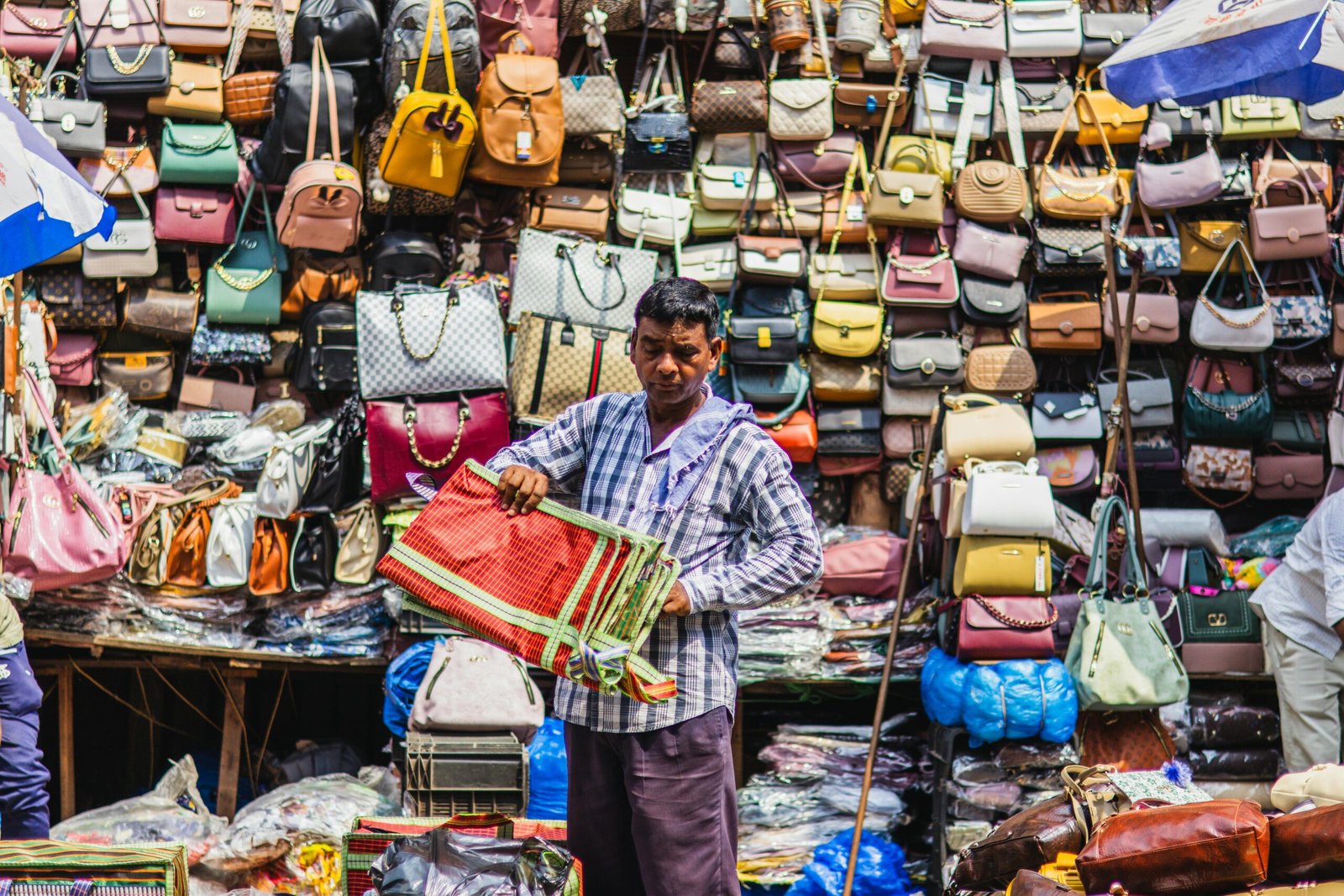 A traveler interacting respectfully with locals at a market in India.