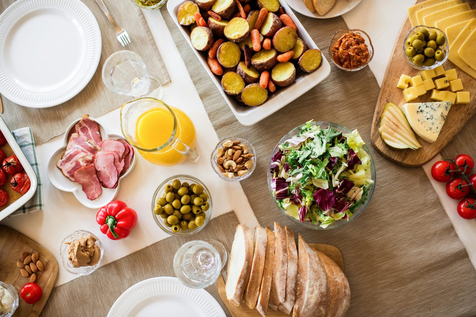 A vibrant table setting with a variety of fresh and delicious foods perfect for a festive gathering.
