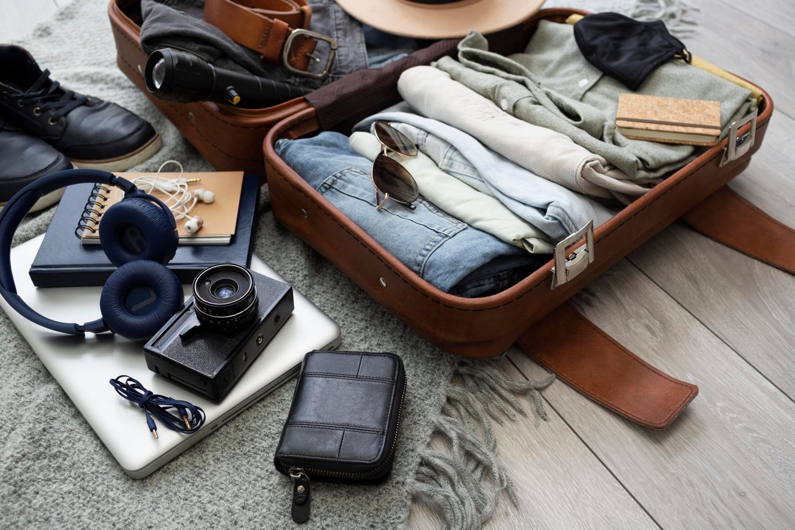 A neatly organized suitcase with smart packing solutions for a summer journey, set against a sunny backdrop.