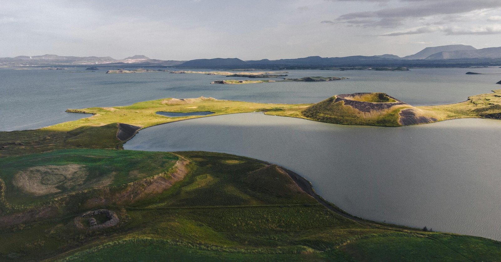 A breathtaking aerial view of Lake Mývatn and its craters in Iceland, showcasing unique geological formations.