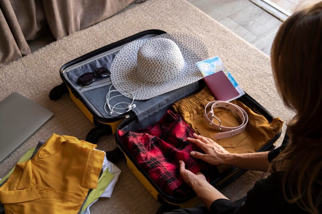 A traveler arranging a suitcase with smart packaging solutions for a summer journey.