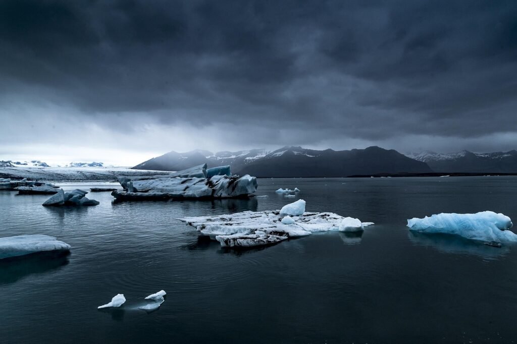 Wide panoramic shot of Iceland's dramatic landscape with glaciers and volcanic terrain