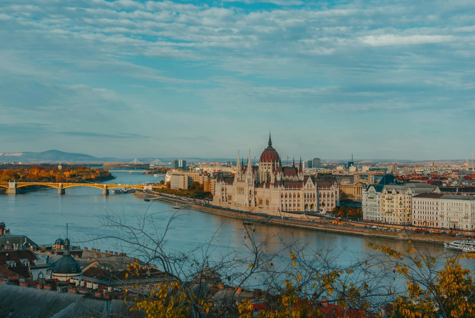 A breathtaking aerial view of Budapest featuring the iconic Parliament along the Danube River.