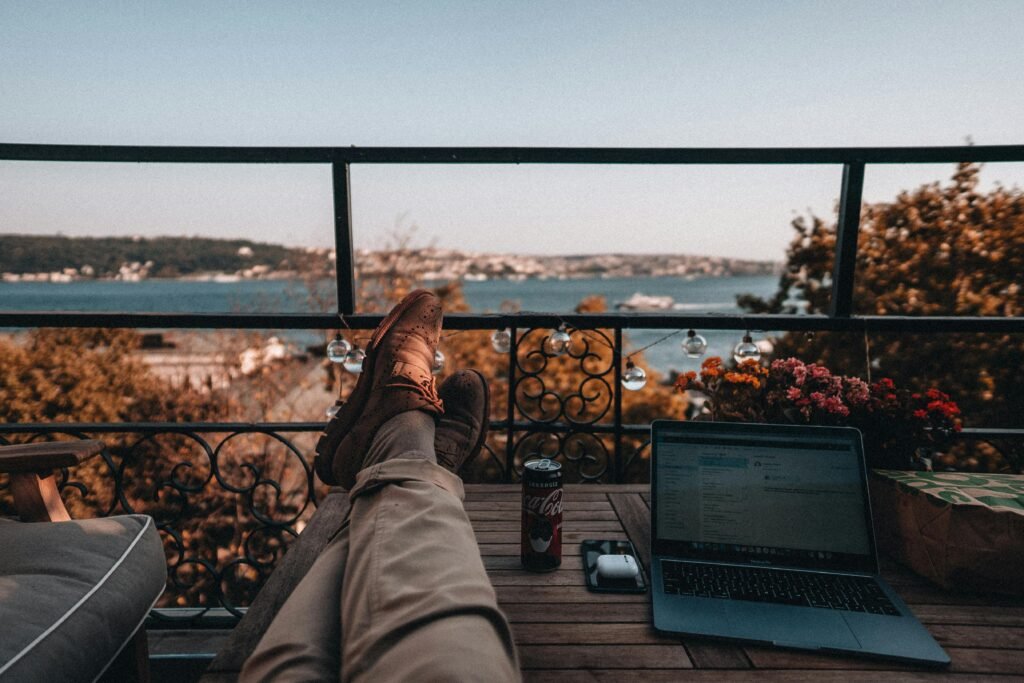 Enjoy a tranquil work-from-home setup with a serene balcony view and essentials.