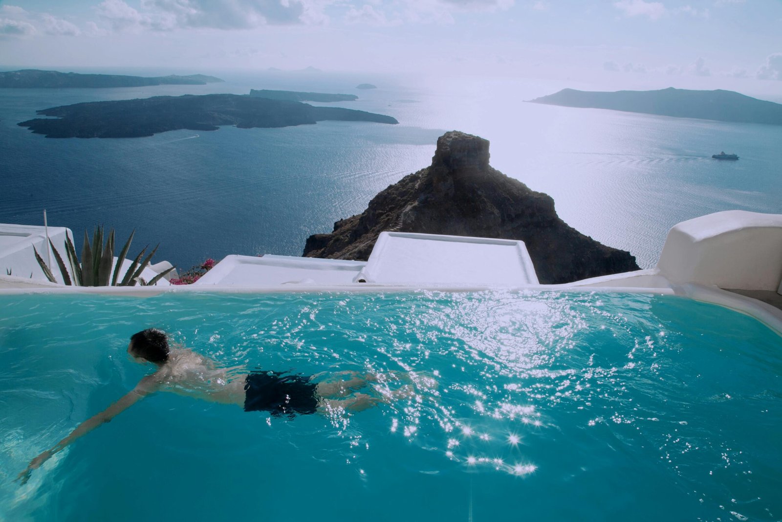 Enjoy a relaxing swim in a pristine infinity pool overlooking the stunning Santorini caldera.