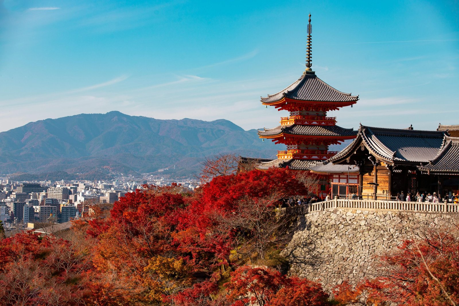 Scenic view of Kiyomizu-dera Temple with autumn foliage in Kyoto, Japan.