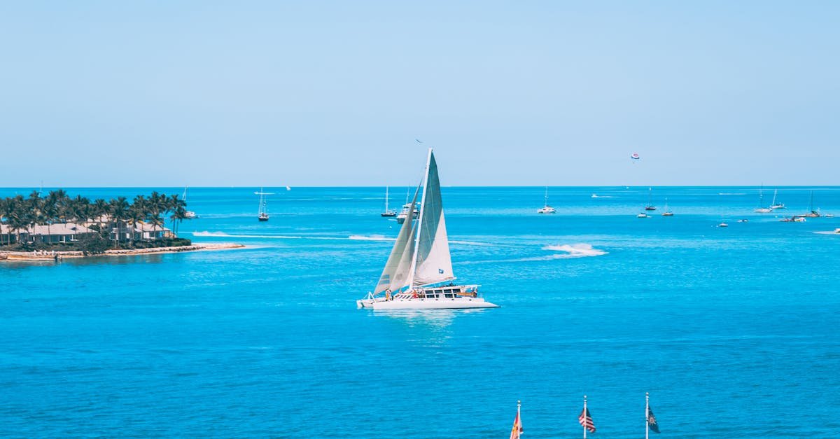 A picturesque sailboat gliding through the turquoise waters of Key West, Florida.